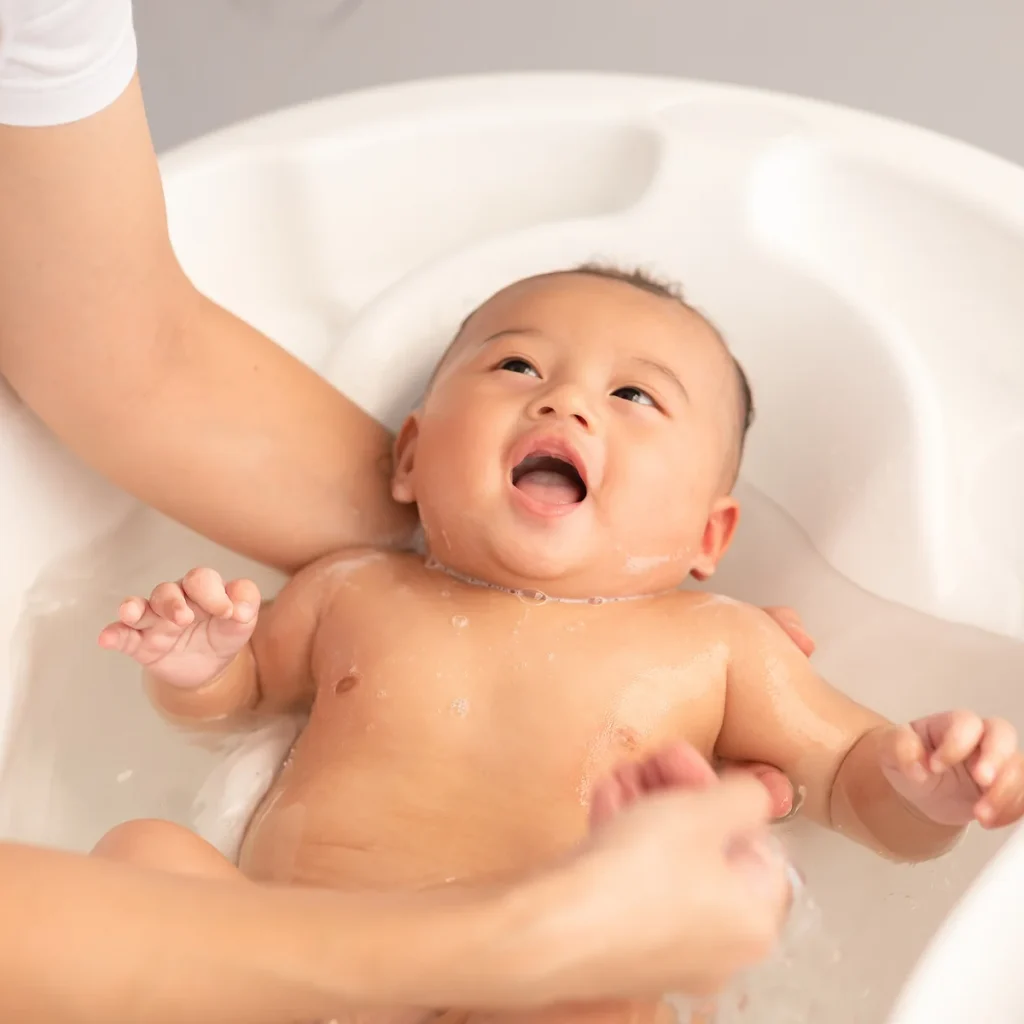 This image has an empty alt attribute; its file name is A_Step-by-Step_Guide_on_How_to_Bath_a_Newborn_Baby-1024x1024.webp